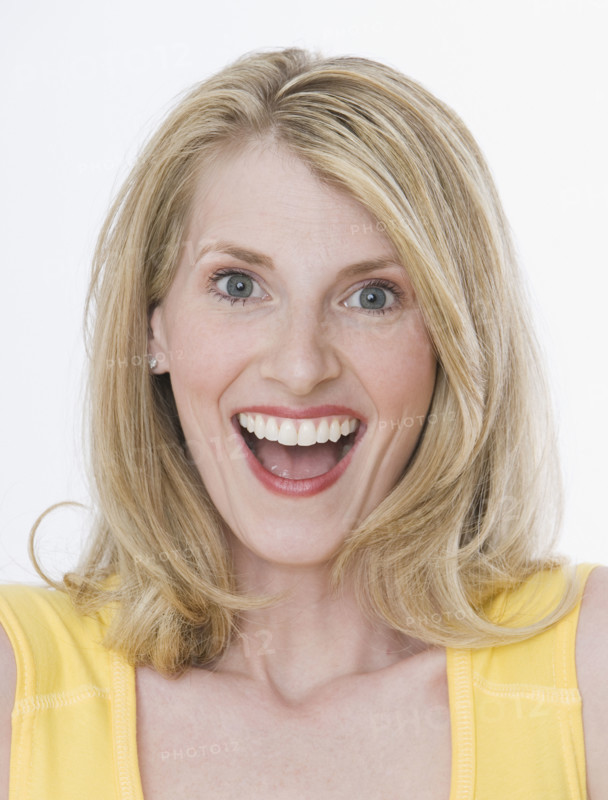 Close up of woman laughing.