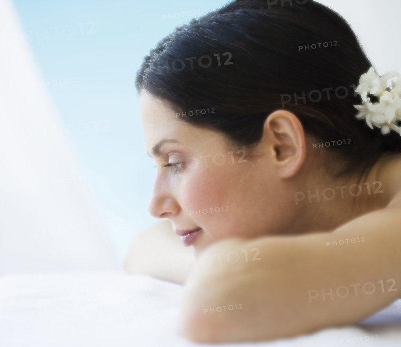 Woman laying on spa table.