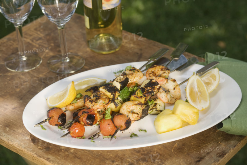 Grilled shish kebab on platter.