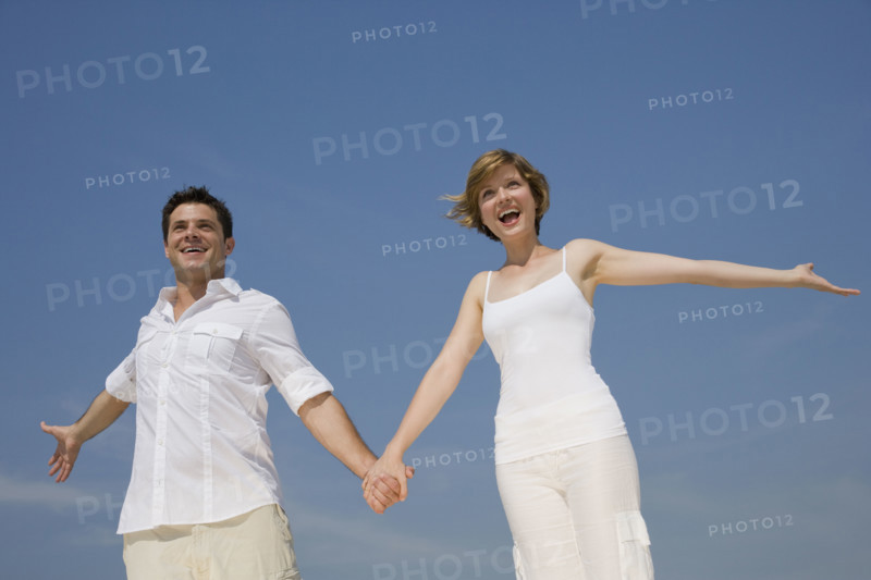 Couple holding hands.