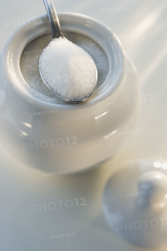 Spoon on sugar bowl.