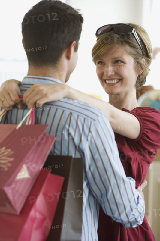 Couple smiling at each other.