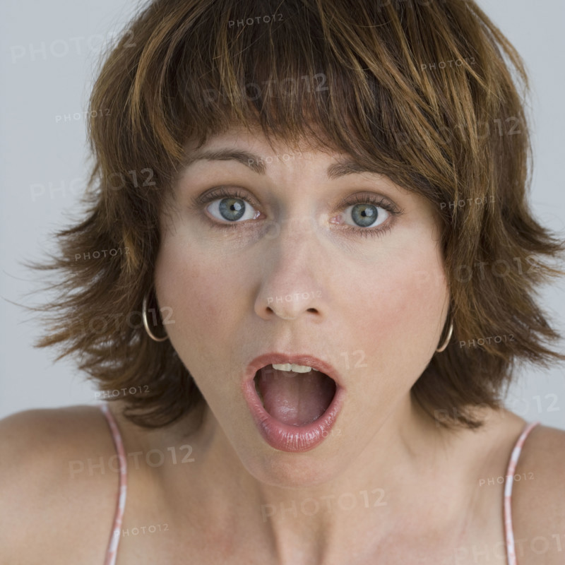 Close up of woman looking surprised.