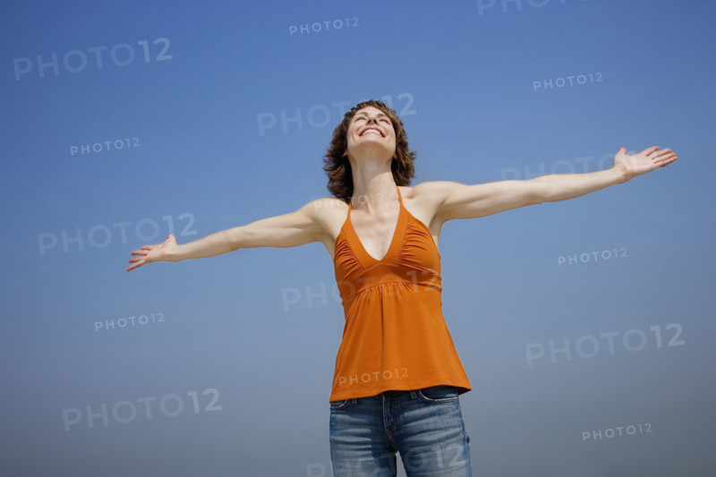 Woman with arms outstretched.