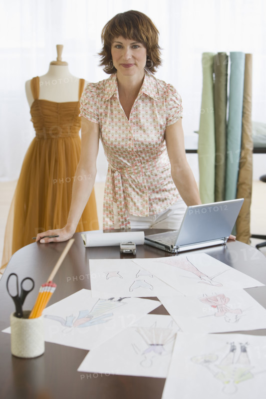Female clothing designer in shop.