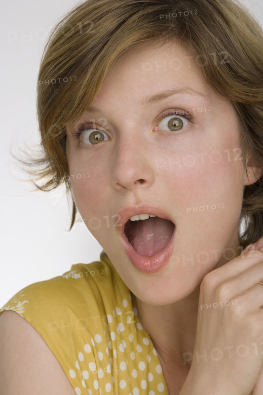 Close up of woman looking surprised.