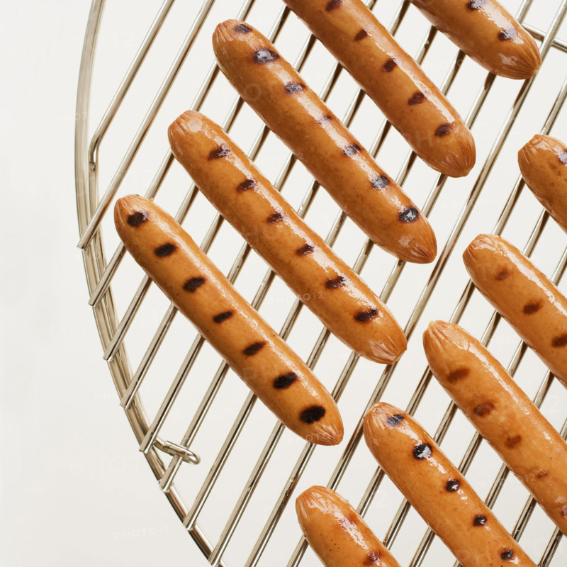 Hot dogs on grill.