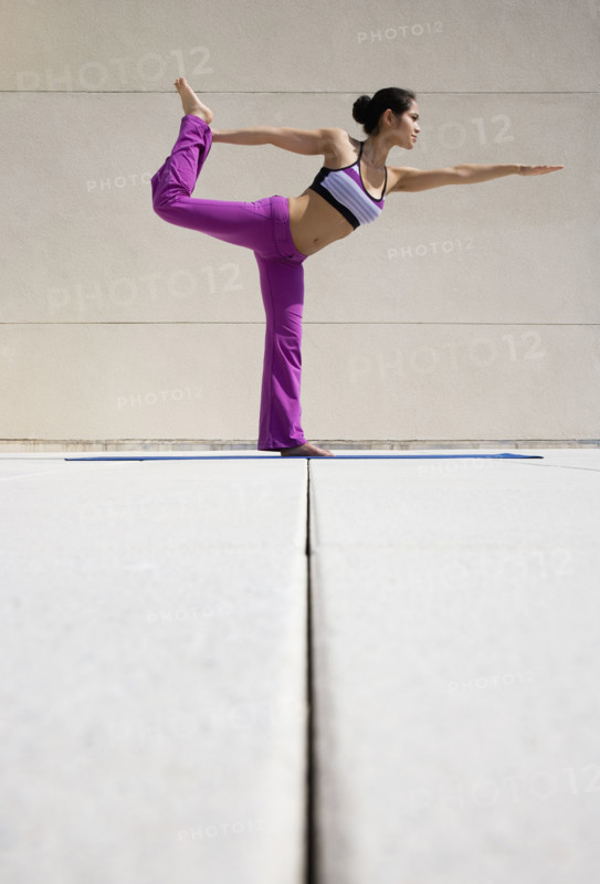 Woman practicing yoga.