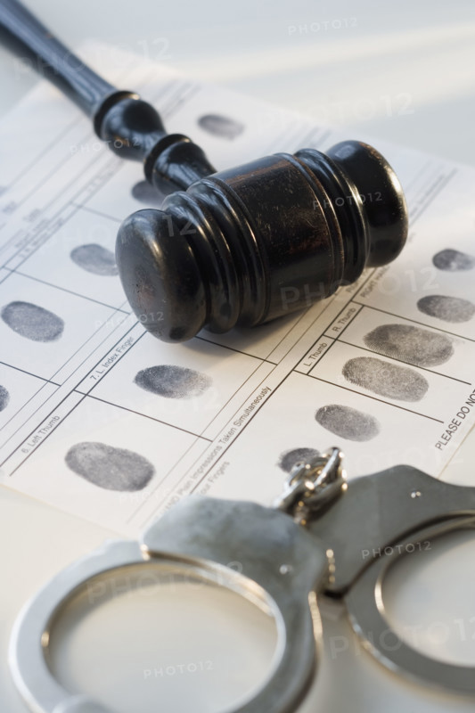 Judge’s gavel on fingerprint card.