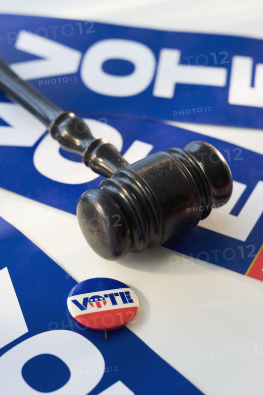 Judge’s gavel on vote signs.