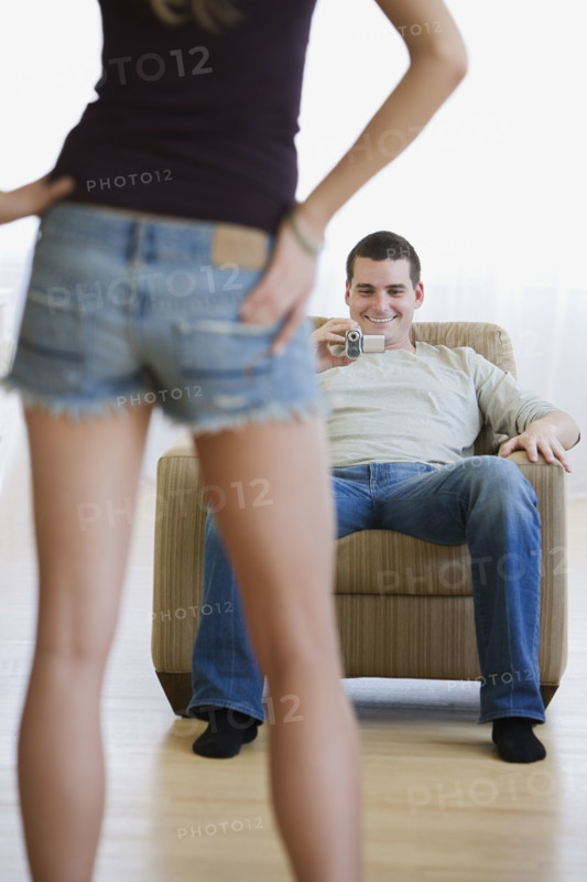 Man video recording girlfriend.
