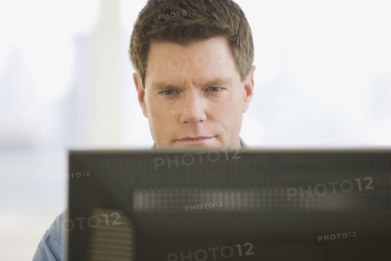 Man looking at computer screen.