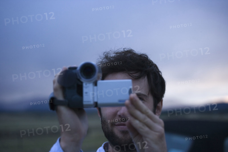 Man using video camera. Date : 2006