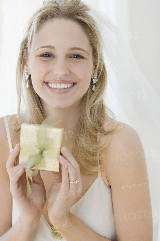 Portrait of bride holding gift. Date : 2007