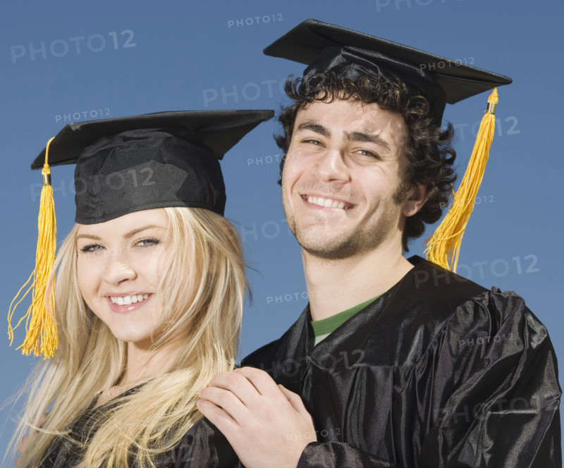 Couple wearing graduation caps and gowns. Date : 2007