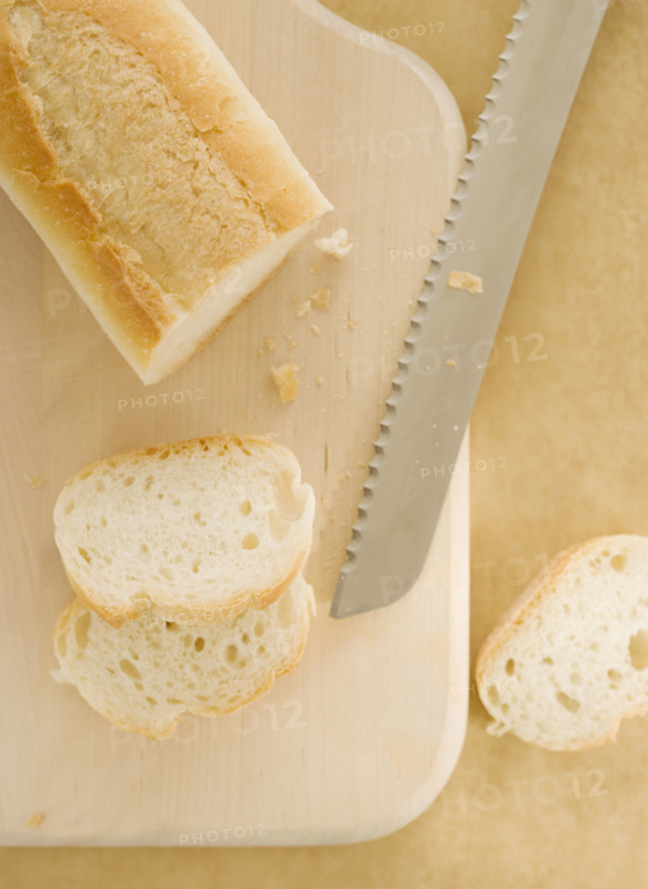 Sliced bread on cutting board. Date : 2006