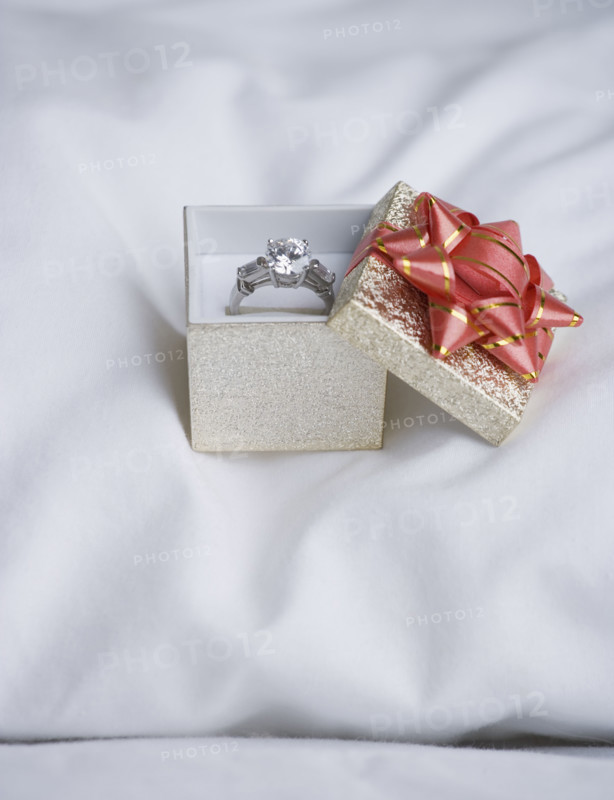 Still life of diamond ring on pillow. Date : 2006