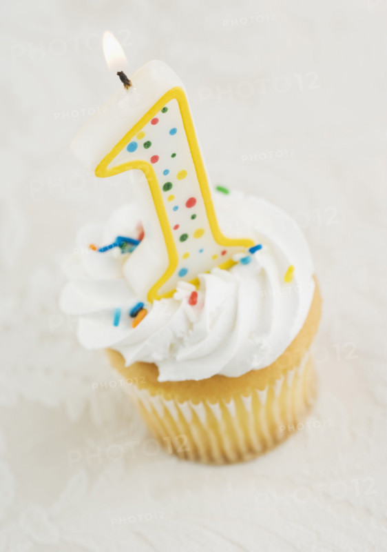 Still life of cupcake with one candle. Date : 2006