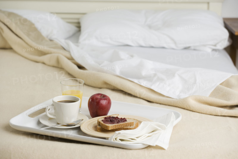 Still life of breakfast tray on bed. Date : 2006