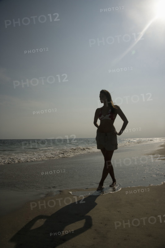 Woman walking on beach. Date : 2007