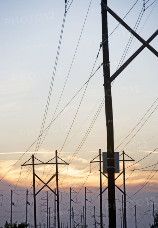 Electrical poles and wires at sunset. Date : 2007