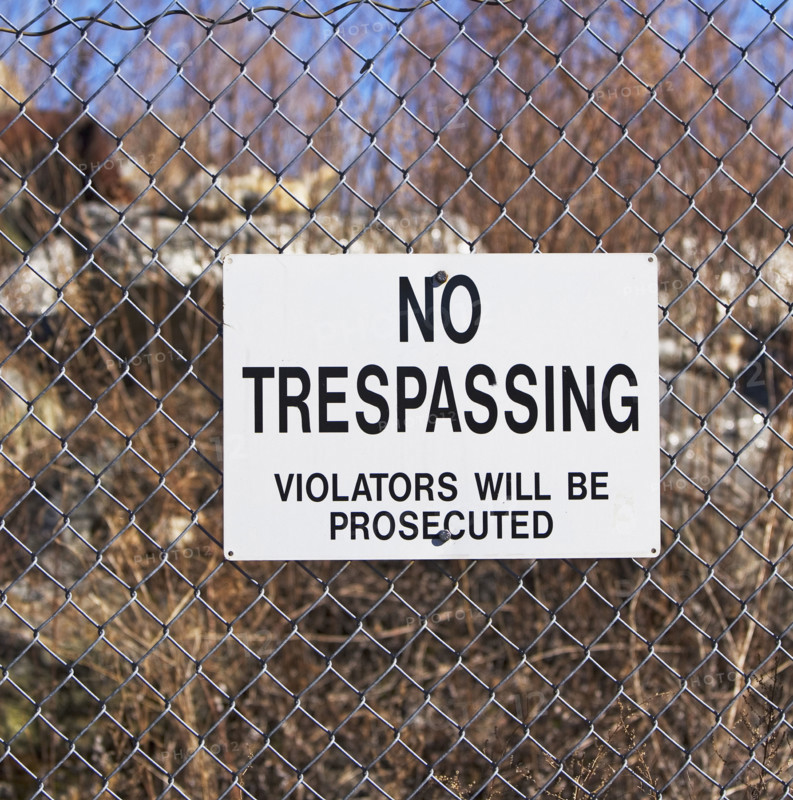No Trespassing sign on fence. Date : 2007