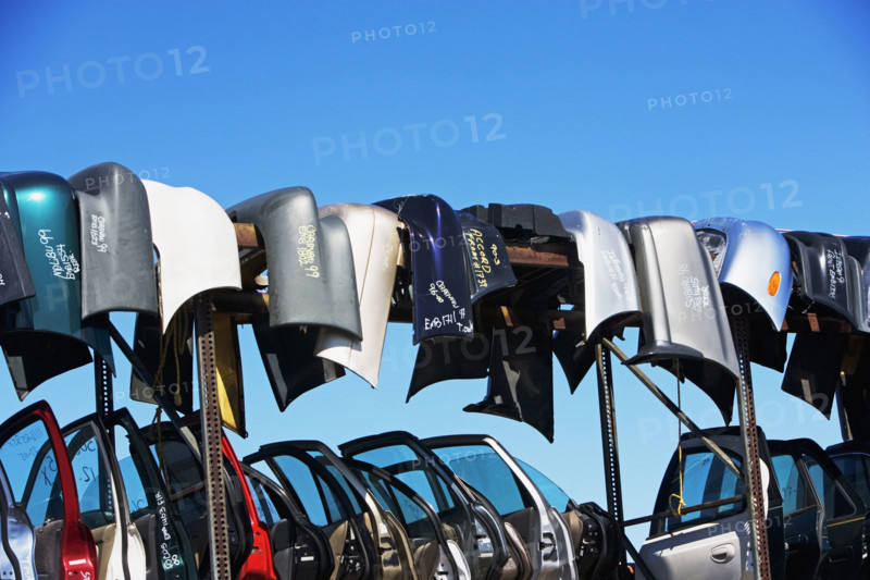 Car doors and bumpers at junkyard. Date : 2007