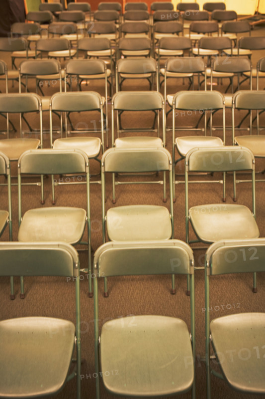 Empty folding chairs in rows. Date : 2007