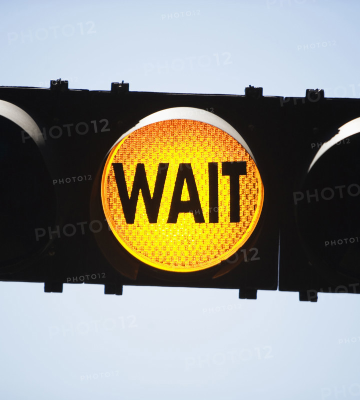 Yellow traffic light reading Wait. Date : 2007