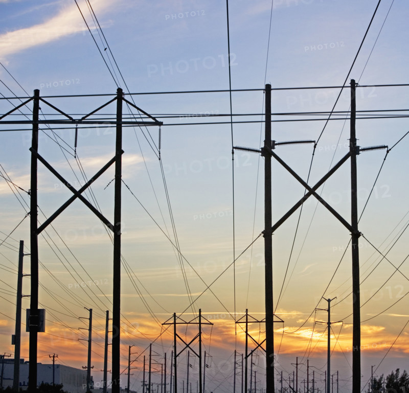 Electrical poles and wires at sunset. Date : 2007