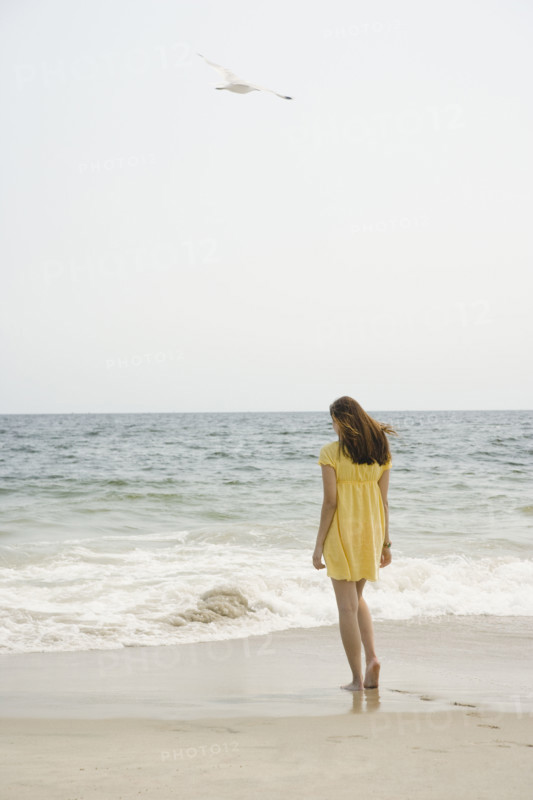 Woman walking on beach. Date : 2007