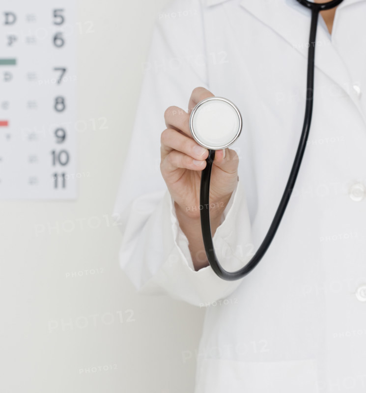 Doctor holding stethoscope. Date : 2007
