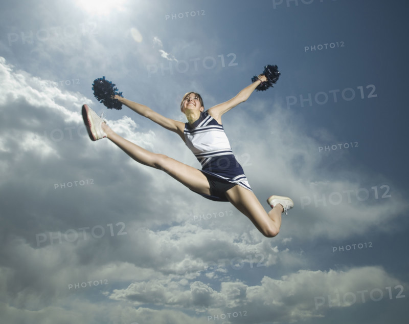 Low angle view of cheerleader jumping. Date : 2007