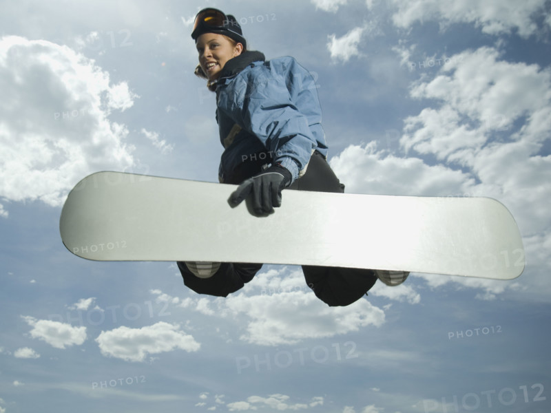 Low angle view of snowboarder jumping. Date : 2007