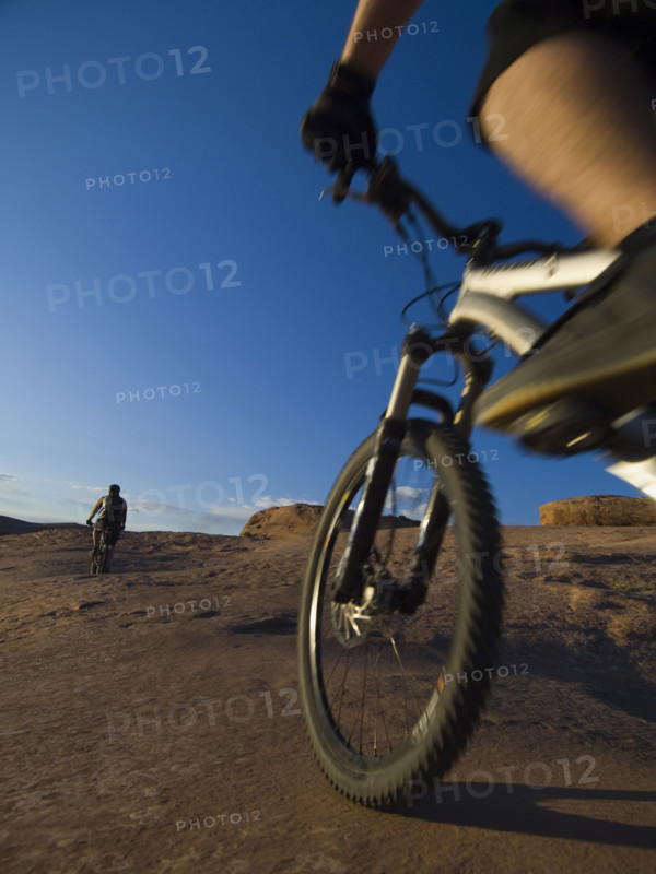 People riding mountain bikes. Date : 2007