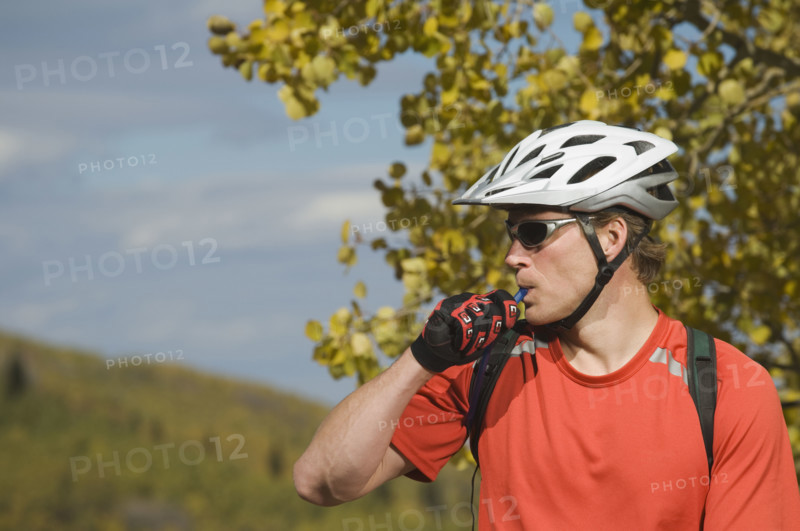 Man wearing bicycle helmet, Utah, United States. Date : 2007