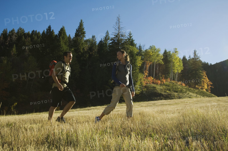 Couple hiking with backpacks, Utah, United States. Date : 2007