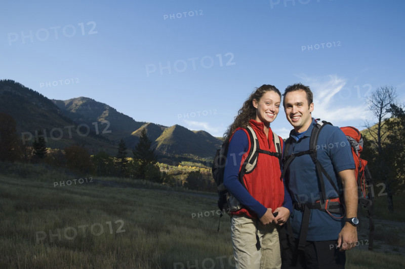 Couple wearing backpacks outdoors, Utah, United States. Date : 2007