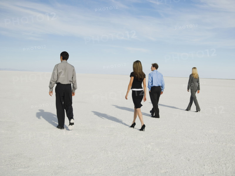 Businesspeople walking on salt flats, Salt Flats, Utah, United States. Date : 2007