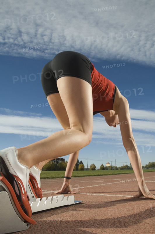 Female runner at starting block, Utah, United States. Date : 2007