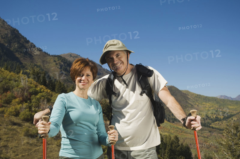 Senior couple holding hiking poles, Utah, United States. Date : 2007