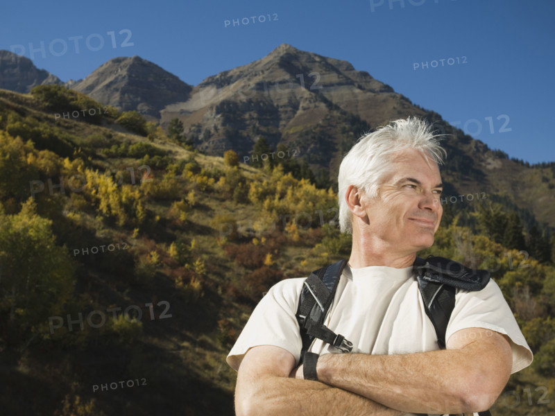 Senior man wearing backpack, Utah, United States. Date : 2007