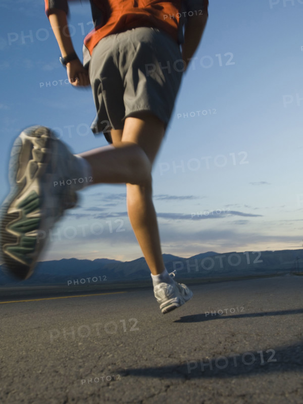 Man in athletic gear running. Date : 2007