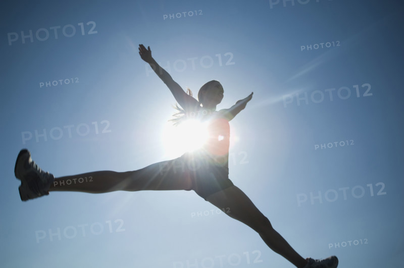 Low angle view of woman jumping. Date : 2007