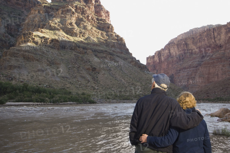 Couple looking at river, Colorado River, Moab, Utah, United States. Date : 2007