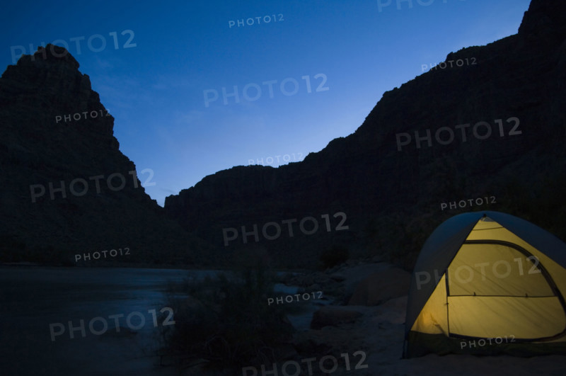Tent next to river at night, Colorado River, Moab, Utah, United States. Date : 2007