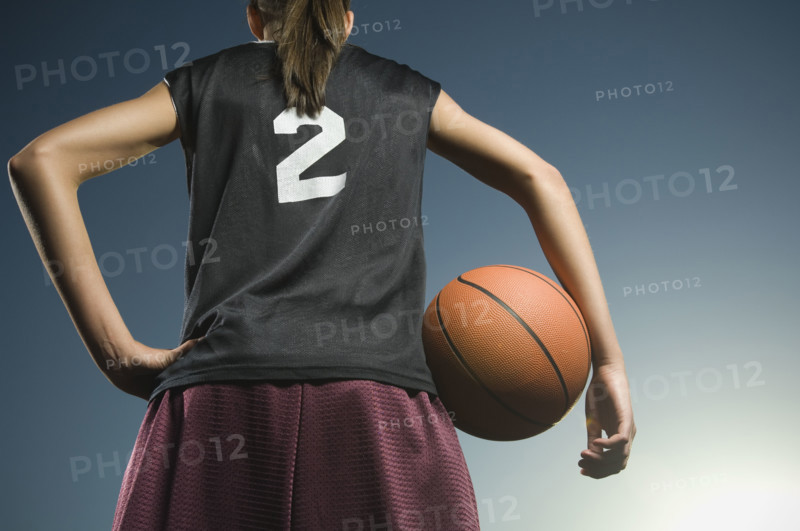 Girl holding basketball. Date : 2007
