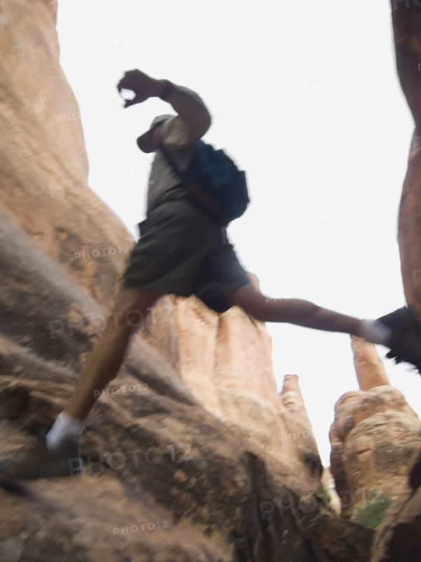 Man jumping over rock formations. Date : 2007