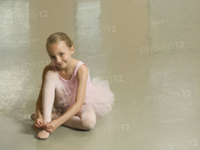 Girl tying ballet shoe. Date : 2007