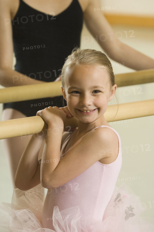 Girl holding on to ballet bar. Date : 2007